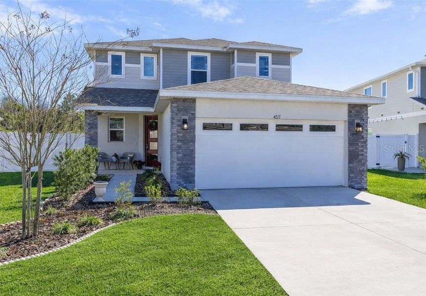 Front exterior of a new home in , St. Cloud, FL, highlighting curb appeal (Image 20). Front exterior of a new home in , St. Cloud, FL, highlighting curb appeal (Image 20).