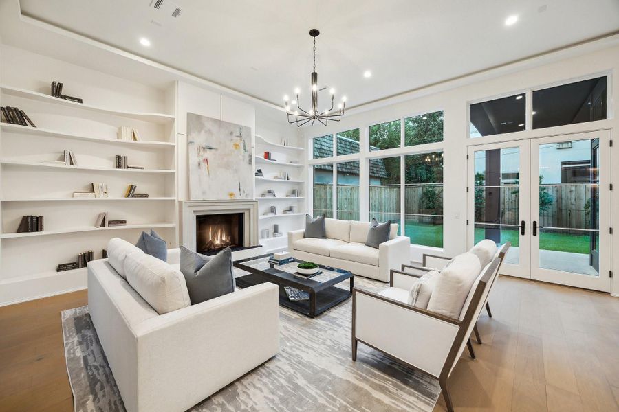 Family Room with 'Shadow Reveal' ceiling and walls of windows with a matching set of doors. There is a ton of natural light in this home. Family Room with 'Shadow Reveal' ceiling and walls of windows with a matching set of doors. There is a ton of natural light in this home.