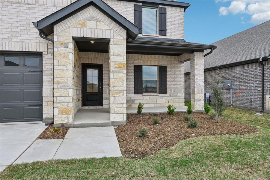 Exterior details and patio area of a home in Parks at Foster Crossing - Signature Series, Anna (Image 3).