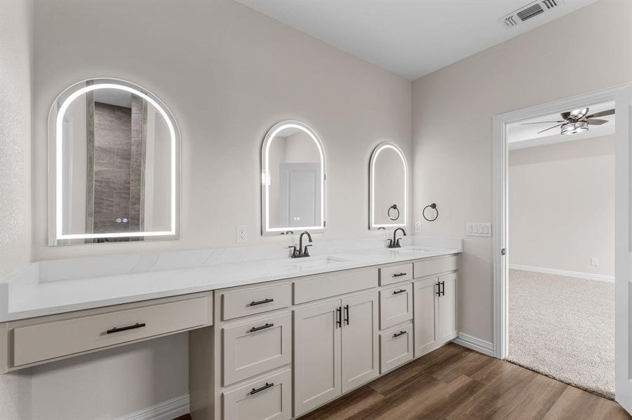 Bathroom with ceiling fan, vanity, and hardwood / wood-style floors Bathroom with ceiling fan, vanity, and hardwood / wood-style floors