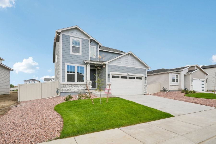 Front exterior of a new home in The Trails at Aspen Ridge, Colorado Springs, CO, highlighting curb appeal (Image 23).