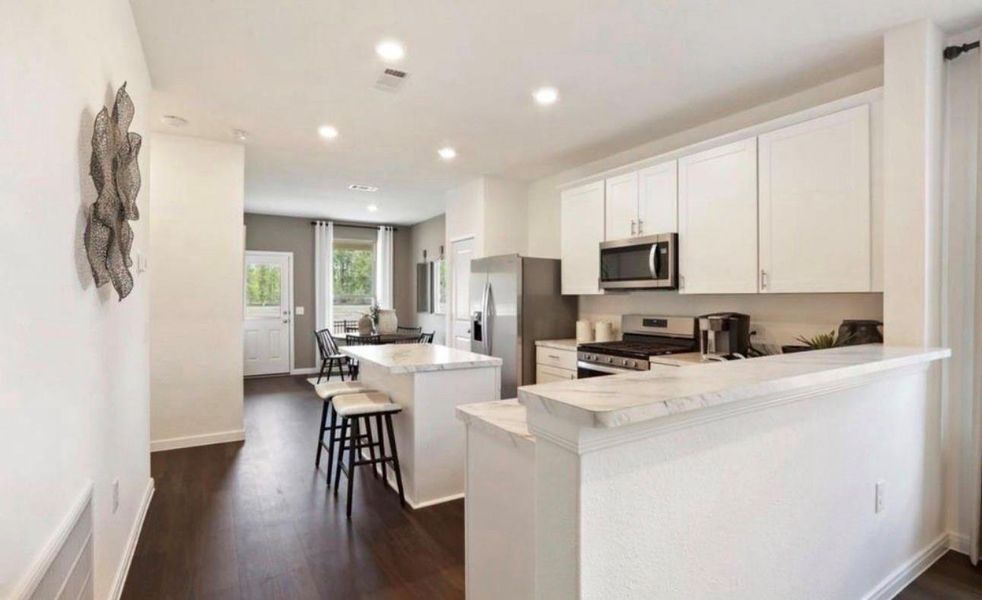 Furnished interior view inside a new home in The Pines At Seven Coves, Conroe (Image 11). Furnished interior view inside a new home in The Pines At Seven Coves, Conroe (Image 11).