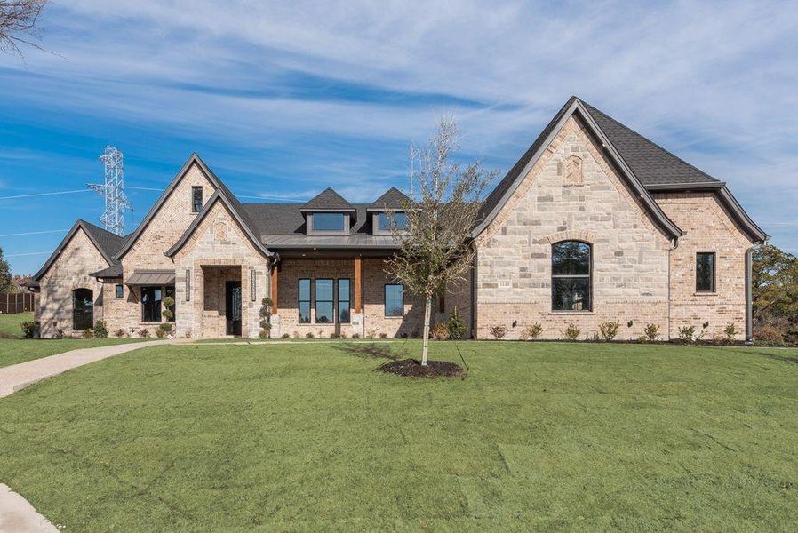 View of front of property with a front yard