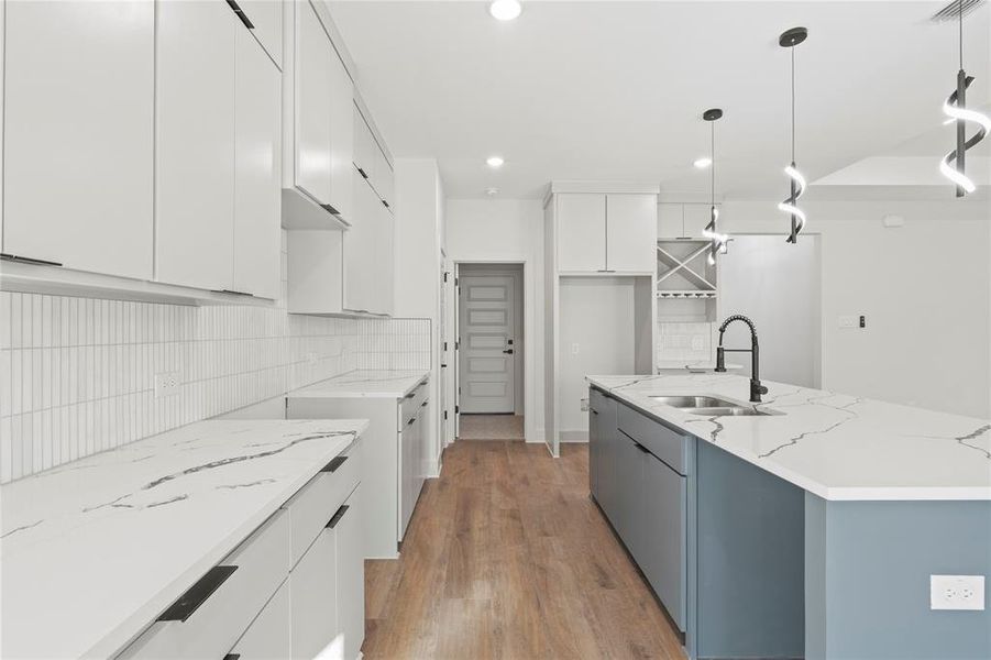 Kitchen featuring a sink and modern cabinets