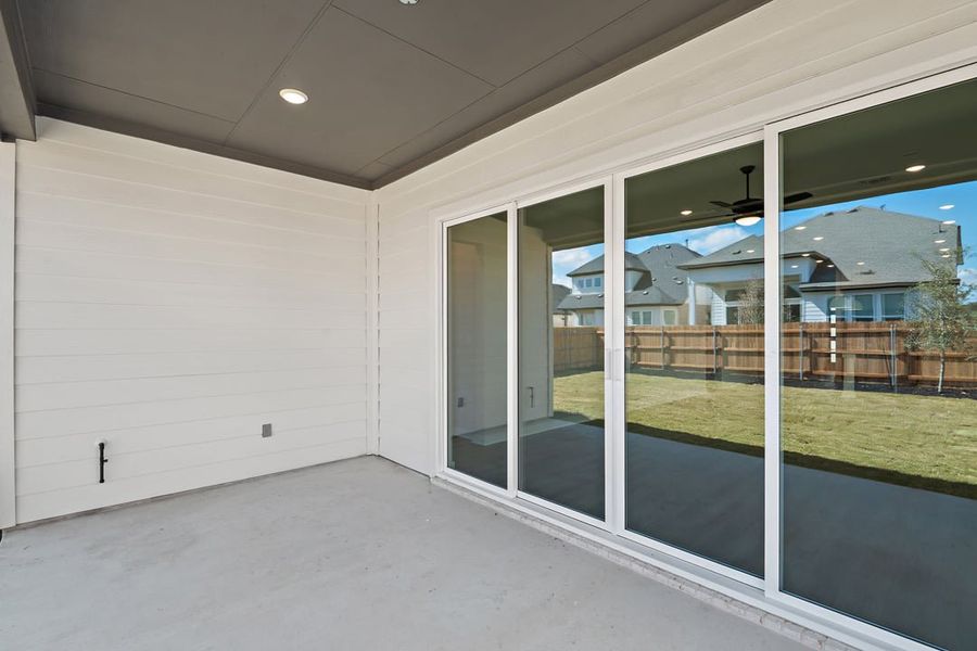 Exterior details and patio area of a home in Arbor Collection at Heritage, Dripping Springs (Image 26).