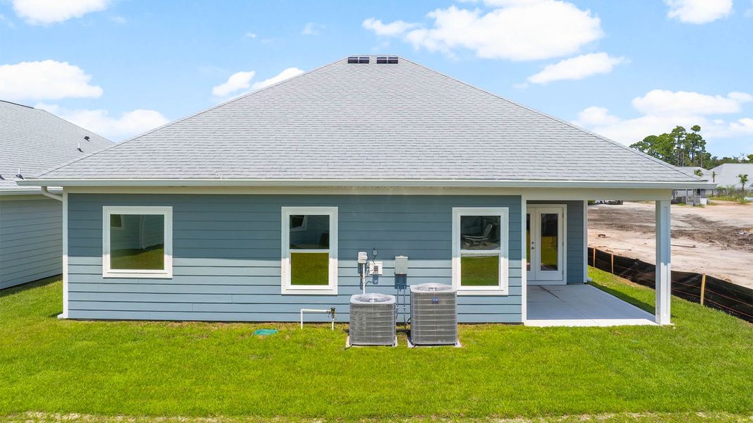 Front exterior of a new home in Windmark Beach, Port Saint Joe, FL, highlighting curb appeal (Image 20). Front exterior of a new home in Windmark Beach, Port Saint Joe, FL, highlighting curb appeal (Image 20).