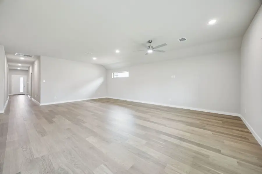 Dining and Living Room in the Hayden home plan by Trophy Signature Homes – REPRESENTATIVE PHOTO