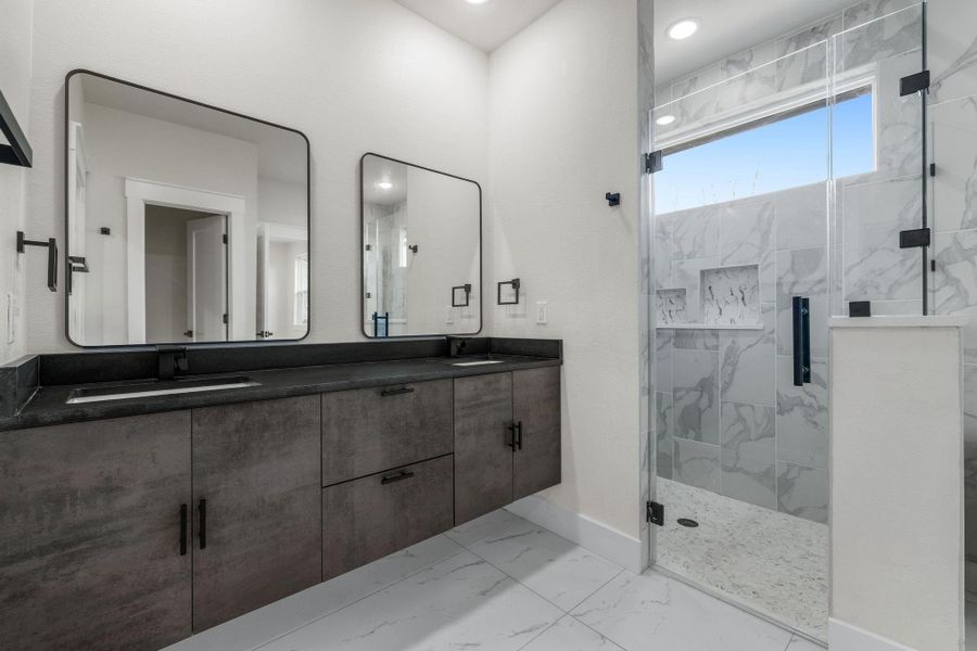 Bathroom with walk in  shower and floating vanity