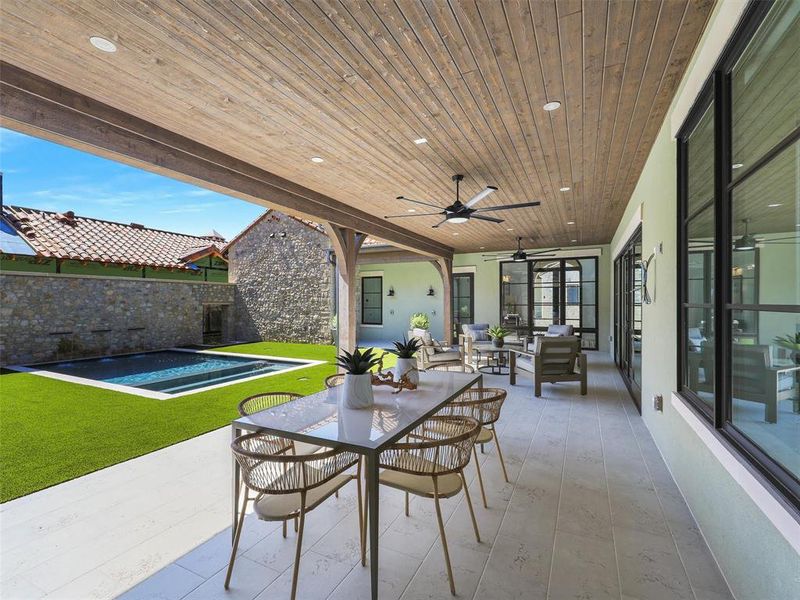 View of patio featuring ceiling fan and an outdoor hangout area