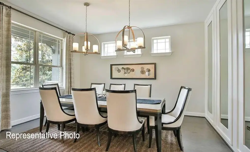 Dining room with a wealth of natural light and a chandelier