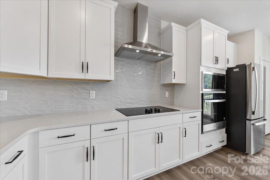 Upgraded tile backsplash and hood