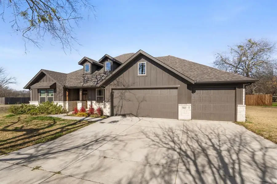 Front exterior of a new home in , Venus, TX, highlighting curb appeal (Image 15). Front exterior of a new home in , Venus, TX, highlighting curb appeal (Image 15).