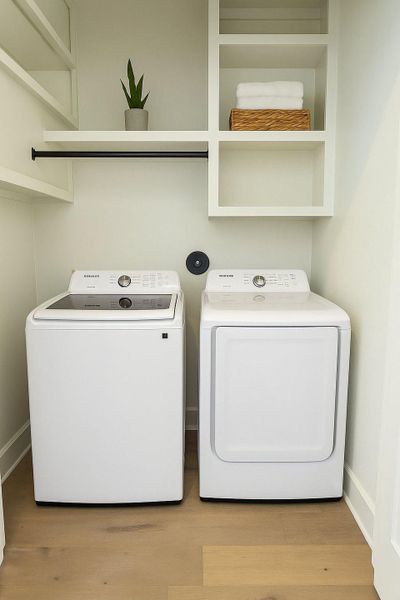 Upstairs hallway with convenient laundry area, featuring clean modern finishes and easy access to bedrooms.