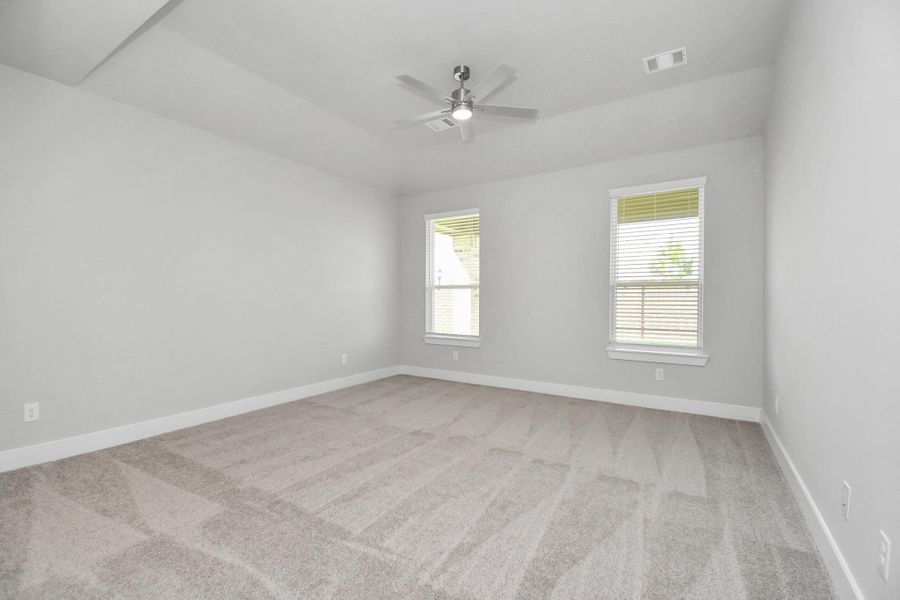 Primary Suite. Sample photo of completed home with similar floor plan. Actual colors and selections may vary.