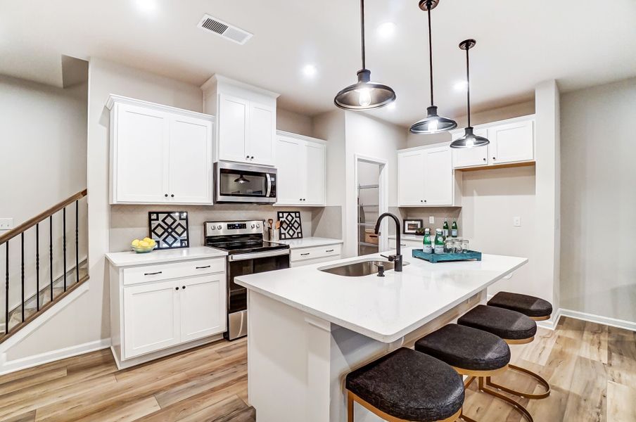 Kitchen with island breakfast bar