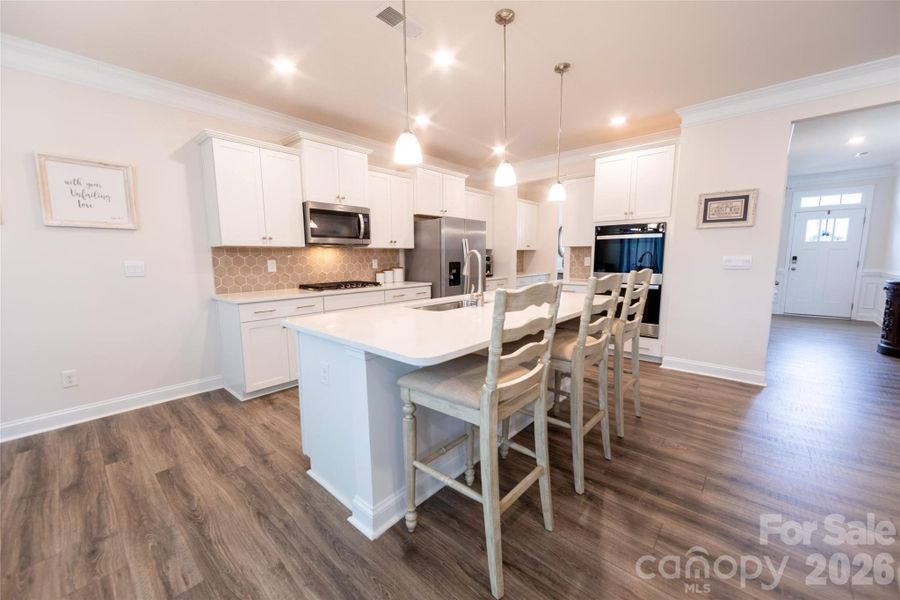 Sleek, modern kitchen featuring stainless steel appliances.