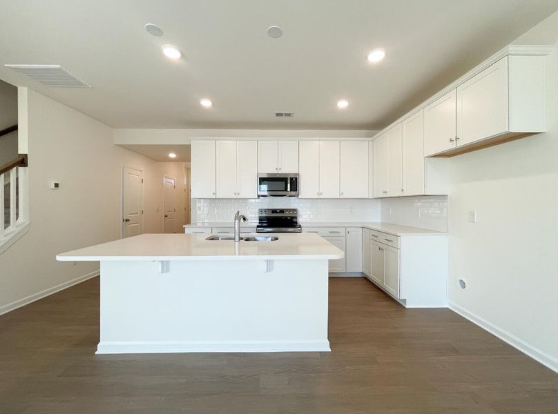 Furnished interior view inside a new home in Bellevue Townhomes, Greenville (Image 7).