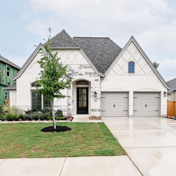 Front exterior of a new home in 6 Creeks, Kyle, TX, highlighting curb appeal (Image 20). Front exterior of a new home in 6 Creeks, Kyle, TX, highlighting curb appeal (Image 20).