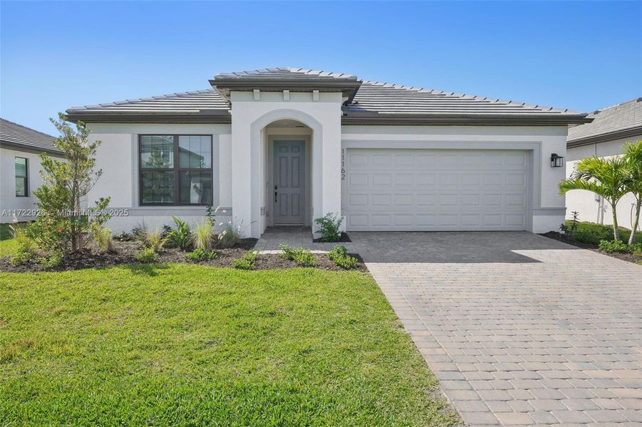 Front exterior of a new home in , Fort Myers, FL, highlighting curb appeal (Image 20). Front exterior of a new home in , Fort Myers, FL, highlighting curb appeal (Image 20).