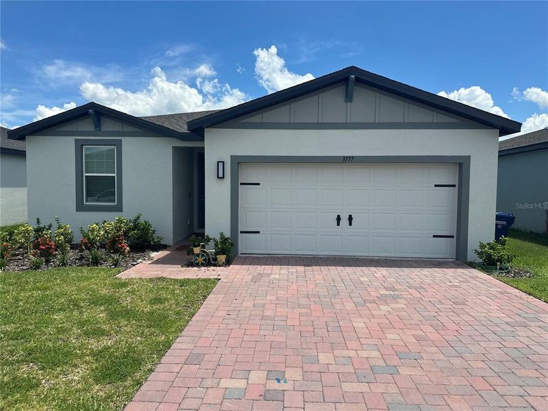 Front exterior of a new home in Villamar - Signature Series, Winter Haven, FL, highlighting curb appeal (Image 21).
