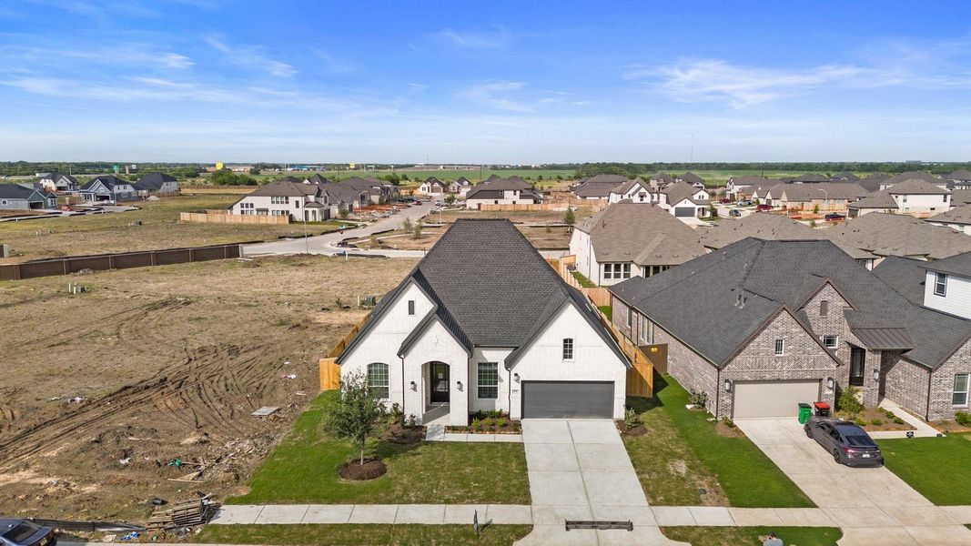 Front exterior of a new home in Brookewater, Rosenberg, TX, highlighting curb appeal (Image 19). Front exterior of a new home in Brookewater, Rosenberg, TX, highlighting curb appeal (Image 19).