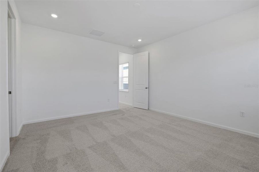 Spacious, unfurnished interior of a new home in Serenade at Ovation, Winter Garden (Image 26).