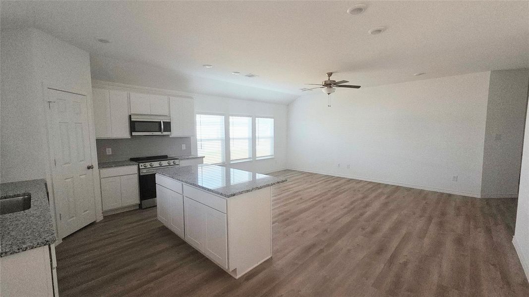View from the back door. Thick granite countertops. Backsplash all the way up the wall. Soft close cabinets.
