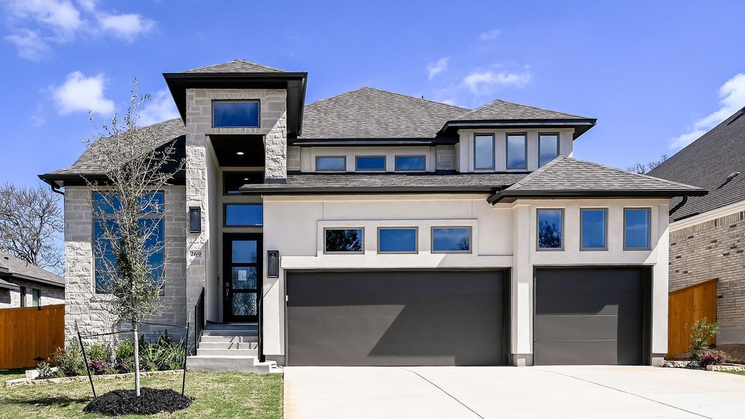 Front exterior of a new home in 6 Creeks, Kyle, TX, highlighting curb appeal (Image 22).