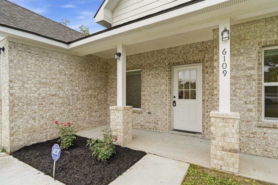 Fresh landscaping, covered front porch