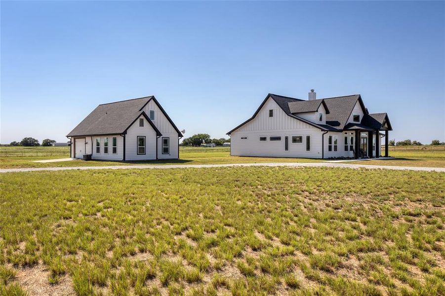 Front exterior of a new home in , Bowie, TX, highlighting curb appeal (Image 18).