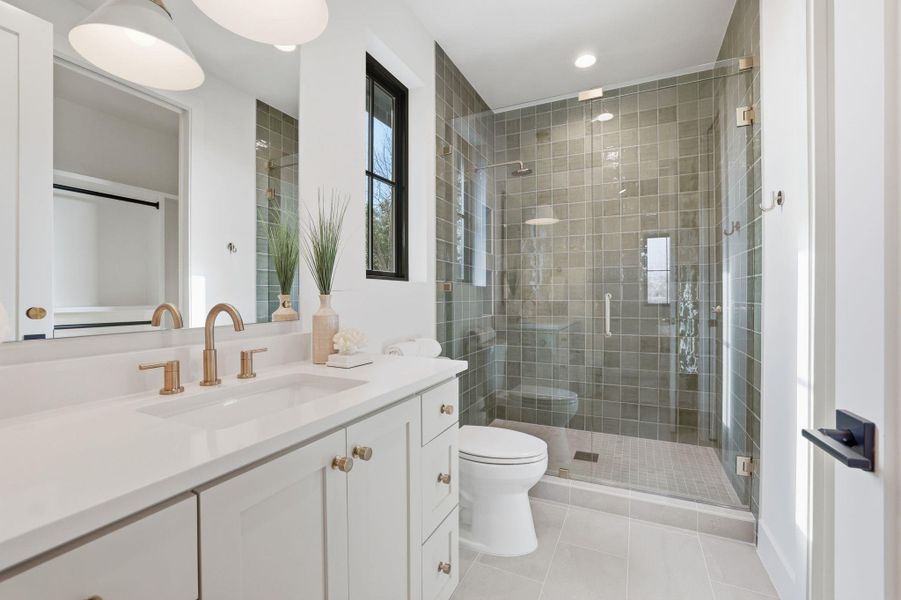 Bathroom with vanity, a stall shower, light tile patterned floors, and recessed lighting
