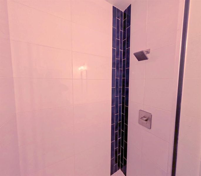 Full bath with tiled shower Full bath with tiled shower