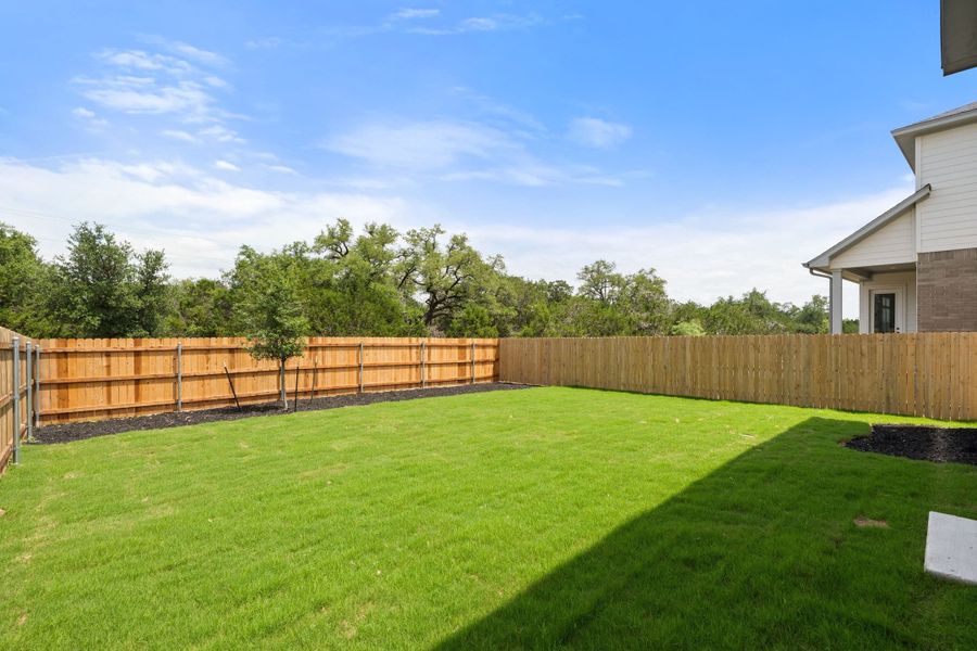 Exterior details and patio area of a home in Heritage, Dripping Springs (Image 30).
