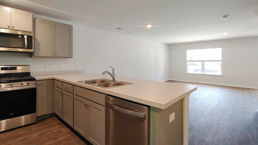 Furnished interior view inside a new home in Garbon Fields, Summerville (Image 9).