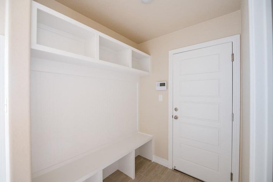 Mudroom featuring light wood finished floors and baseboards Mudroom featuring light wood finished floors and baseboards