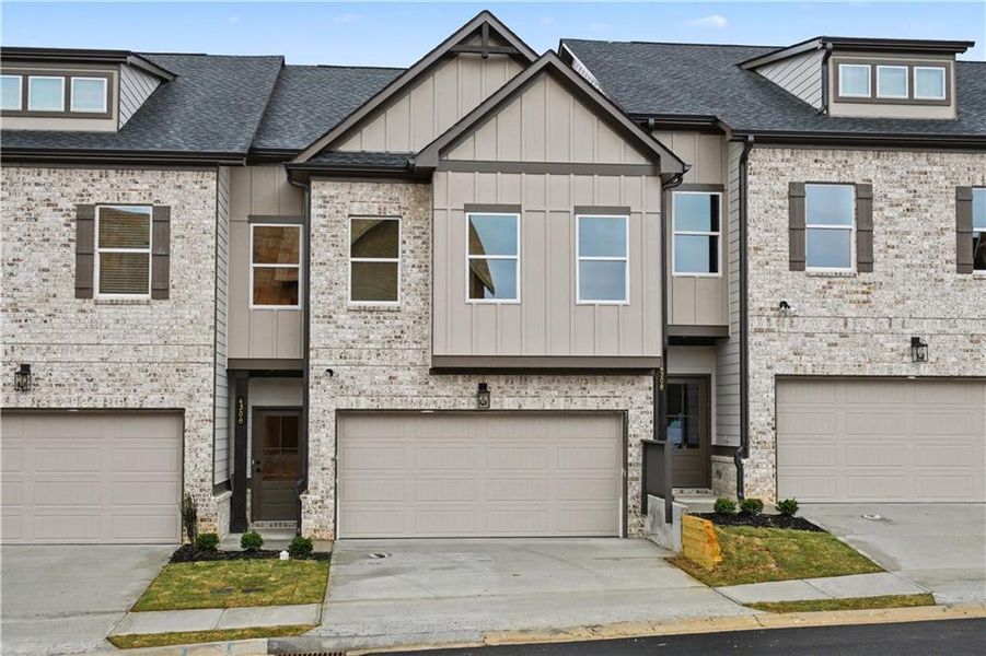 Front exterior of a new home in , Norcross, GA, highlighting curb appeal (Image 1). Front exterior of a new home in , Norcross, GA, highlighting curb appeal (Image 1).