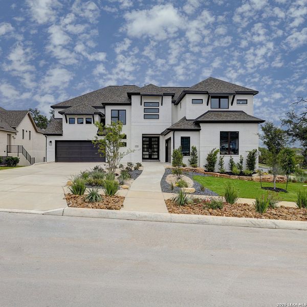 Front exterior of a new home in Esperanza, Boerne, TX, highlighting curb appeal (Image 21).