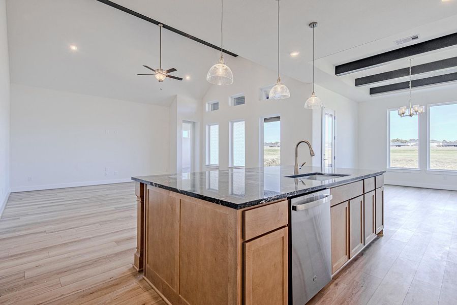 Kitchen island with seating and open sightlines to the living area.