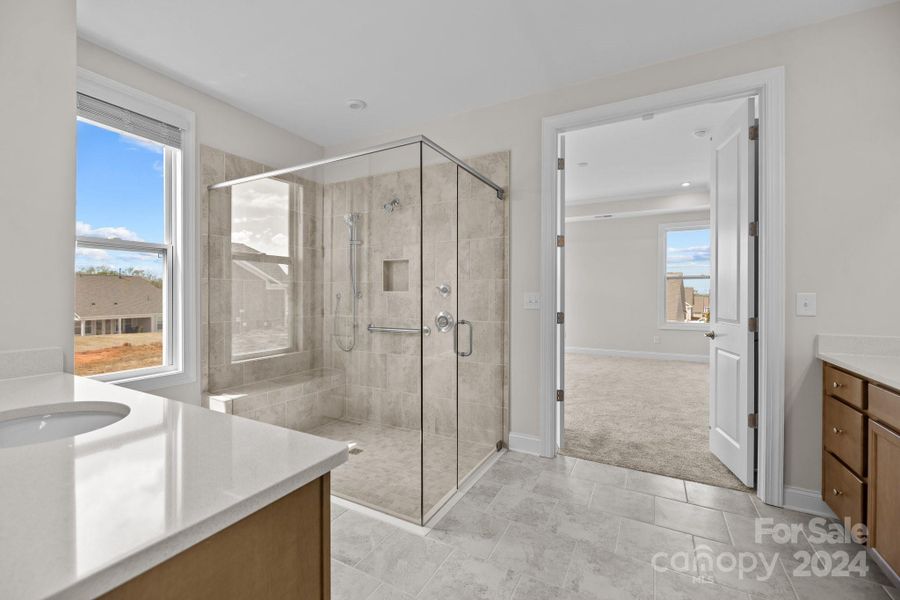 This ensuite Primary bath has it all!