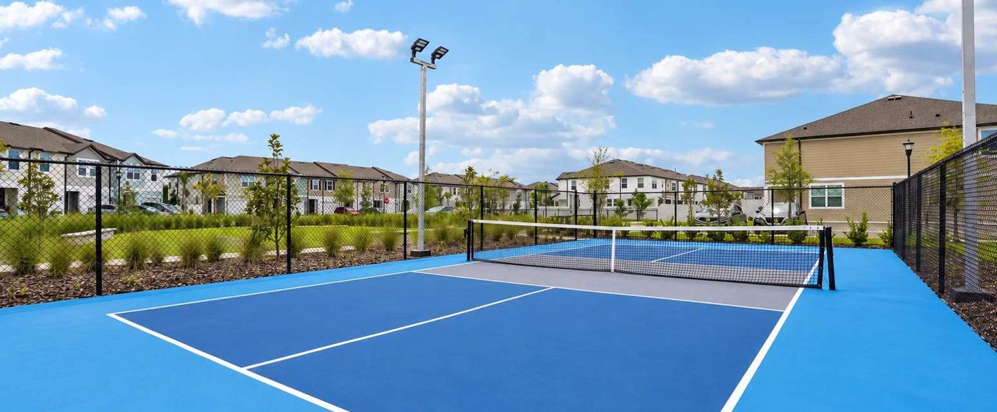 Community pickleball court with lights for evening play