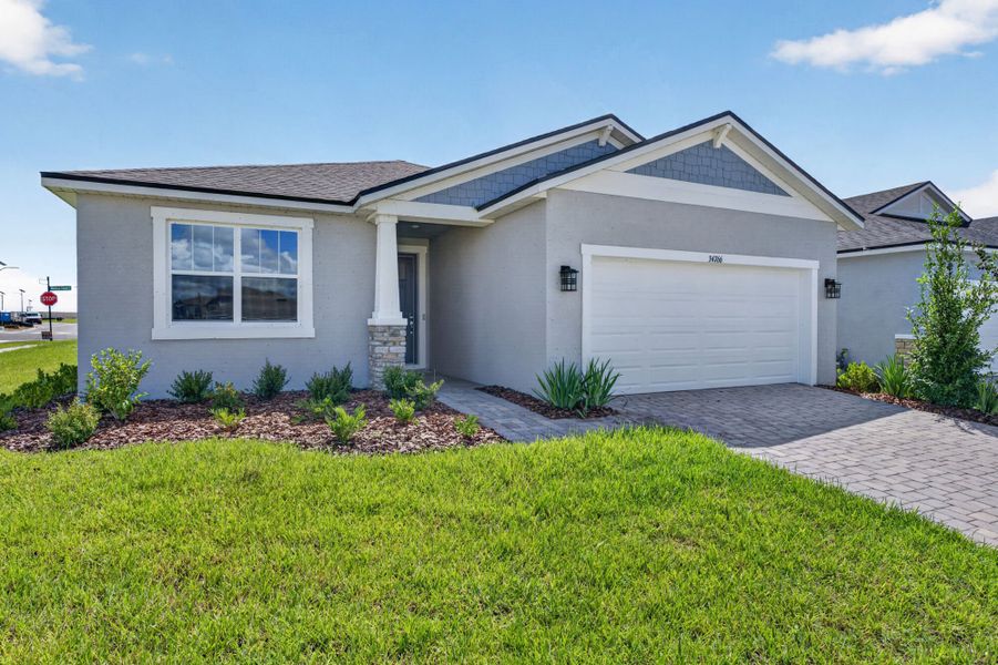 Front exterior of a new home in Pasadena Ridge Master, Dade City, FL, highlighting curb appeal (Image 1). Front exterior of a new home in Pasadena Ridge Master, Dade City, FL, highlighting curb appeal (Image 1).