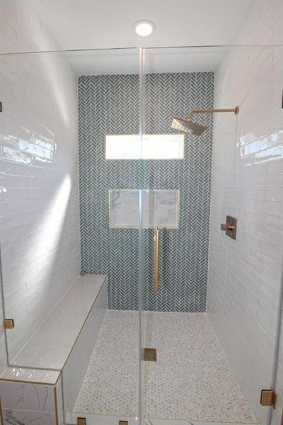 Bathroom featuring a shower stall Bathroom featuring a shower stall