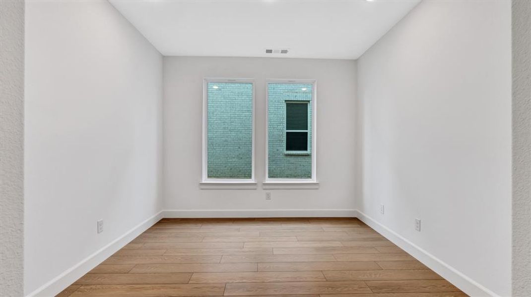 Spare room featuring light hardwood / wood-style flooring