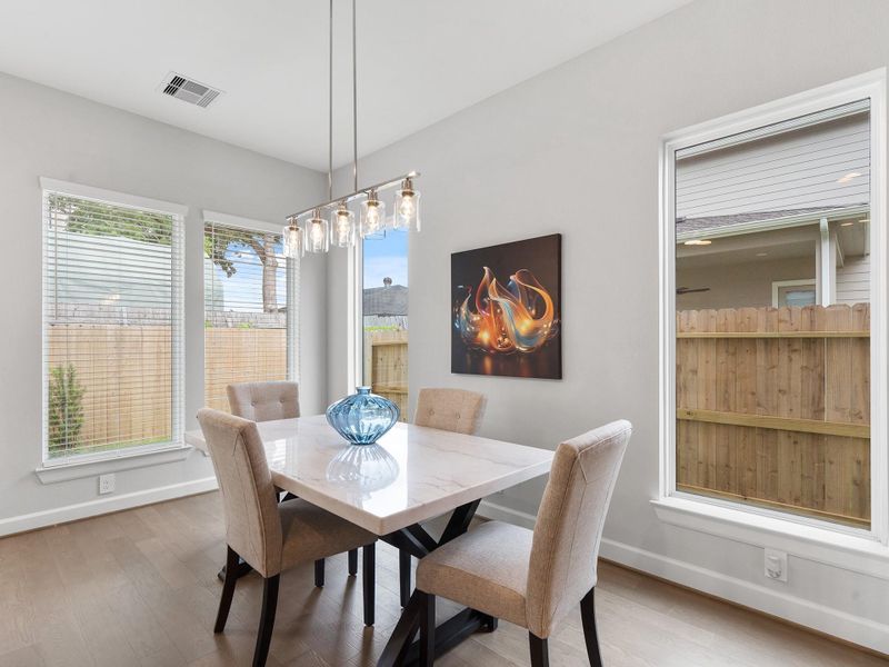 The ROCcreek features a bright, open living room designed for effortless entertaining and stylish everyday comfort. Image depicts home as-is.