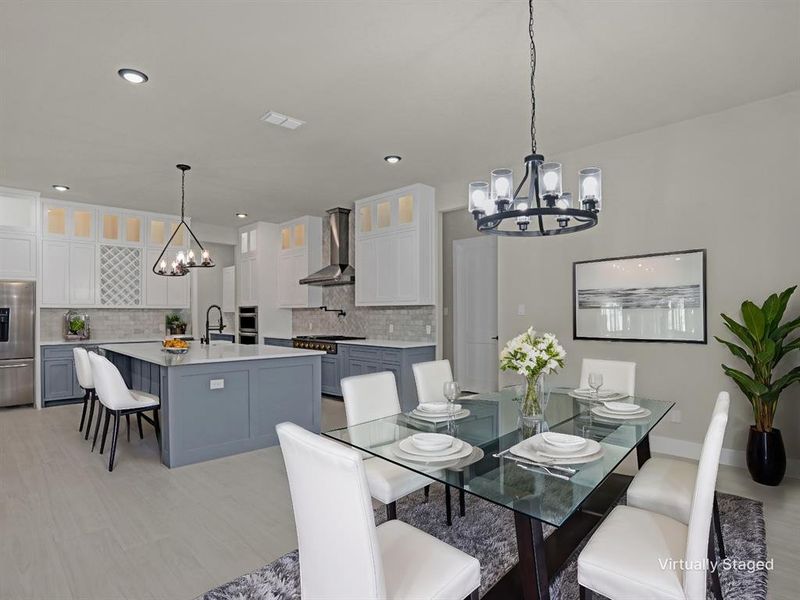 Dining area with sink and a chandelier