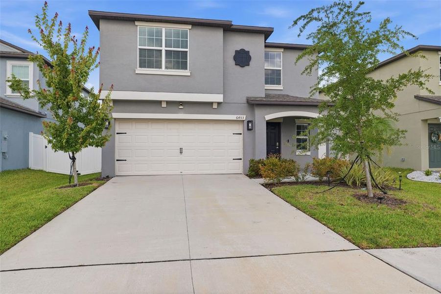 Front exterior of a new home in , Zephyrhills, FL, highlighting curb appeal (Image 27).