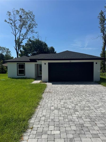 Front exterior of a new home in , Ocala, FL, highlighting curb appeal (Image 1).