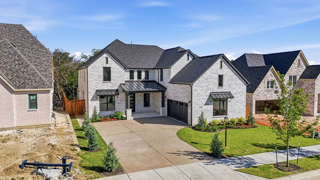 Front exterior of a new home in Inspiration - Paradise Village, St. Paul, TX, highlighting curb appeal (Image 26). Front exterior of a new home in Inspiration - Paradise Village, St. Paul, TX, highlighting curb appeal (Image 26).