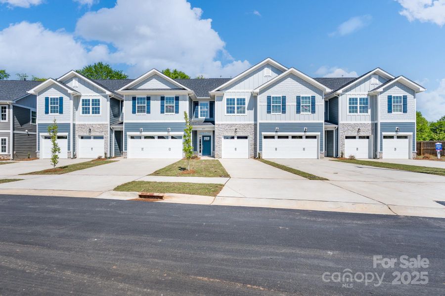 Front exterior of a new home in Pine Trace, Gastonia, NC, highlighting curb appeal (Image 1).