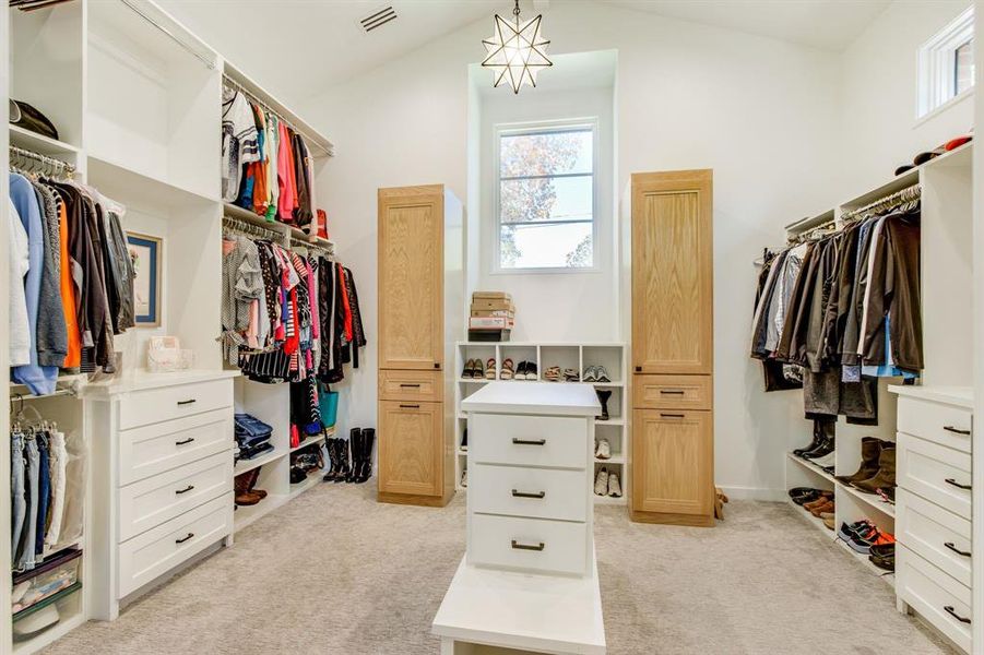 Gigantic primary closet with a connection for a stackable washer and dryer